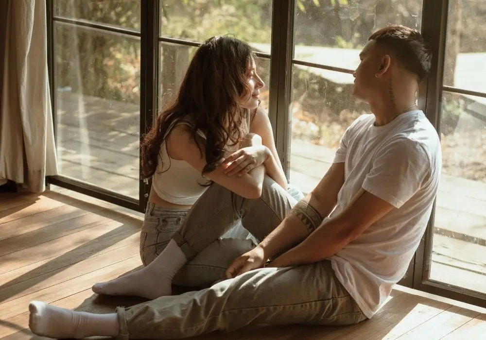 Mixed-race couple talking together, representing intercultural relationship and marriage counselling in Vancouver