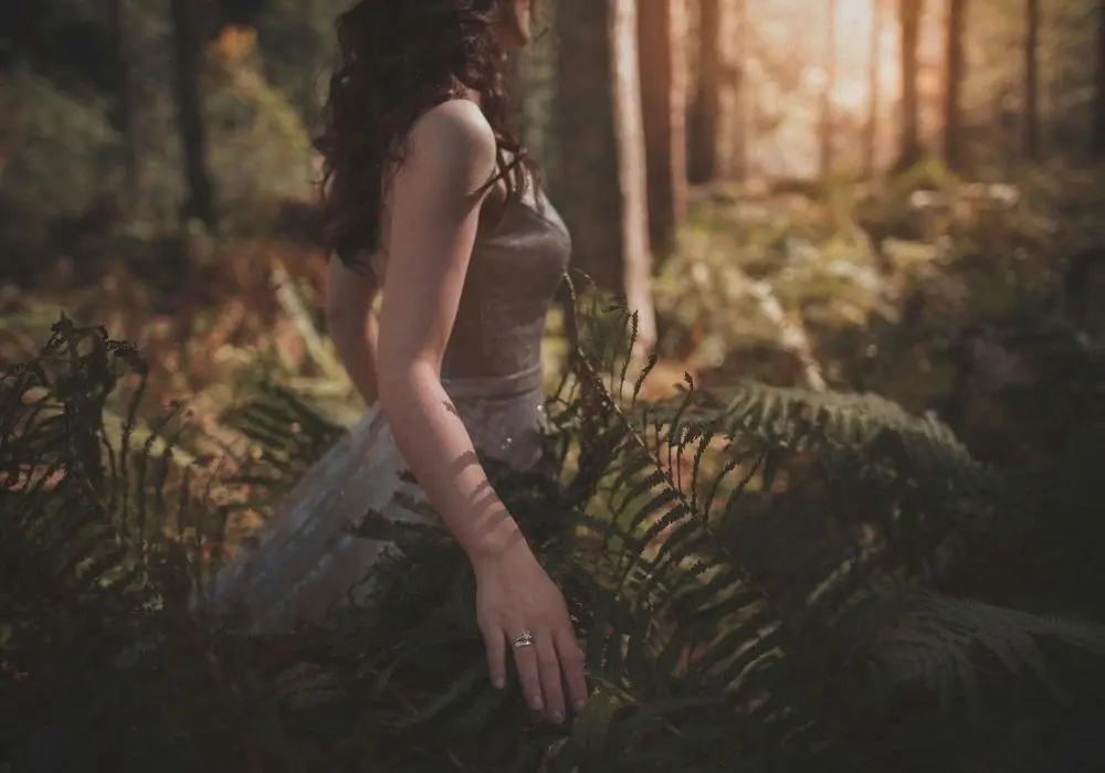 A person standing quietly in nature, representing self-worth counselling in Vancouver